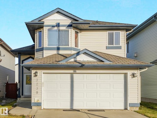 View of front facade featuring driveway and a garage - 3239 21 Street, Edmonton, AB - Outdoor