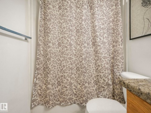 Full bath with vanity and a shower with curtain - 3239 21 Street, Edmonton, AB - Indoor Photo Showing Bathroom