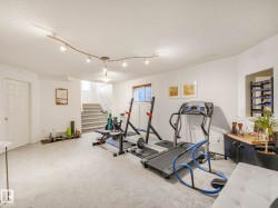 Exercise area with carpet and baseboards - 