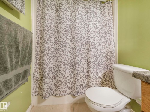 Full bathroom featuring tile patterned flooring and vanity - 3239 21 Street, Edmonton, AB - Indoor Photo Showing Bathroom