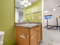 Bathroom featuring vanity and light carpet - 