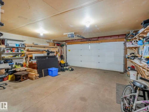 Garage featuring a workshop area and a garage door opener - 3239 21 Street, Edmonton, AB - Indoor Photo Showing Garage