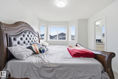 Bedroom featuring ensuite bathroom - 3248 22 Street, Edmonton, AB - Indoor Photo Showing Bedroom