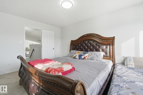 Carpeted bedroom with baseboards - 3248 22 Street, Edmonton, AB - Indoor Photo Showing Bedroom