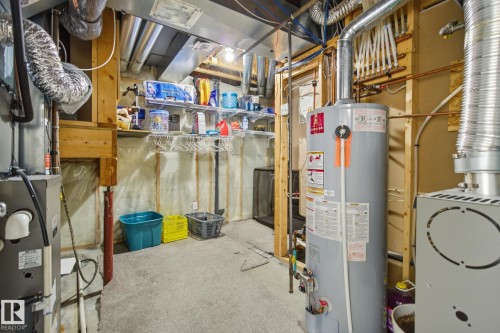 Utility room with water heater and heating unit - 3248 22 Street, Edmonton, AB - Indoor Photo Showing Basement
