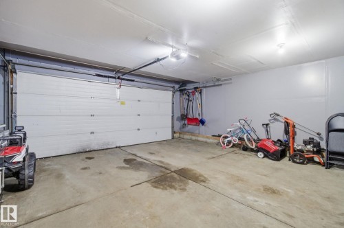 Garage with a garage door opener - 3248 22 Street, Edmonton, AB - Indoor Photo Showing Garage