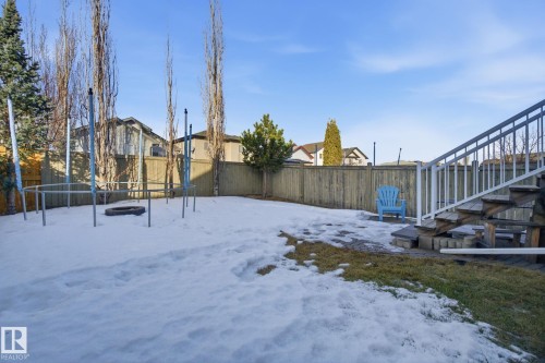Snowy yard featuring a fenced backyard and a residential view - 3248 22 Street, Edmonton, AB - Outdoor