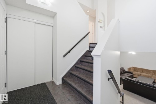 Staircase with tile patterned flooring - 3248 22 Street, Edmonton, AB - Indoor Photo Showing Other Room