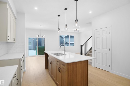 1332 11 Avenue, Edmonton, AB - Indoor Photo Showing Kitchen With Double Sink