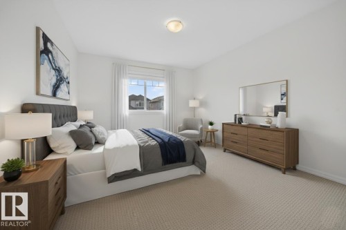 Bedroom featuring carpet flooring and baseboards - 5212 1A Avenue, Edmonton, AB - Indoor Photo Showing Bedroom