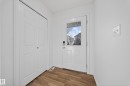 Entryway featuring wood finished floors and baseboards - 5212 1A Avenue, Edmonton, AB  - Indoor Photo Showing Other Room 