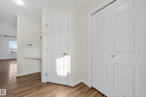 Doorway featuring wood finished floors and baseboards - 5212 1A Avenue, Edmonton, AB - Indoor Photo Showing Other Room