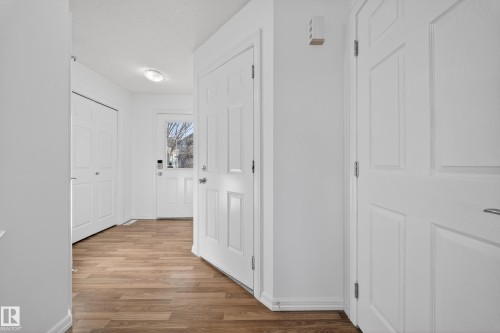 Corridor featuring light wood-style flooring and baseboards - 5212 1A Avenue, Edmonton, AB - Indoor Photo Showing Other Room