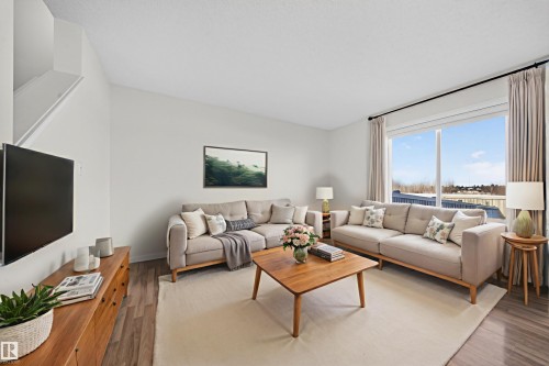 Living area featuring light wood-style floors - 5212 1A Avenue, Edmonton, AB - Indoor Photo Showing Living Room