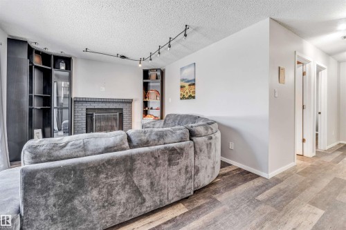 3824 48 Street, Edmonton, AB - Indoor Photo Showing Other Room With Fireplace