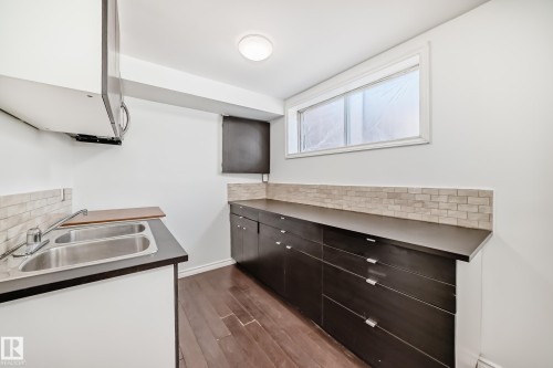 9623/9625 73 Avenue Nw, Edmonton, AB - Indoor Photo Showing Kitchen With Double Sink