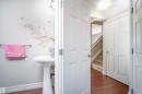 Bathroom featuring dark wood finished floors and a textured ceiling - 13 5317 3 Avenue, Edmonton, AB  - Indoor Photo Showing Other Room 