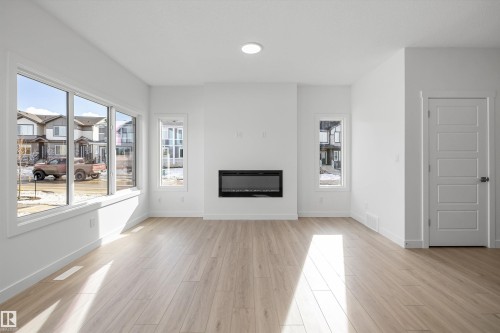 4503 Warbler Loop, Edmonton, AB - Indoor Photo Showing Living Room With Fireplace