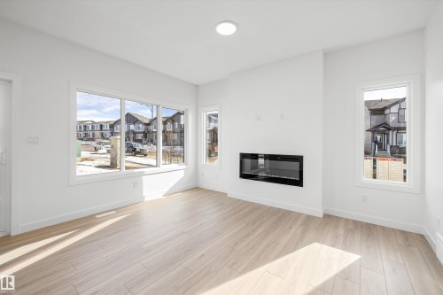 4503 Warbler Loop, Edmonton, AB - Indoor Photo Showing Living Room With Fireplace