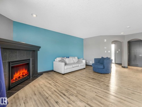 60 Becker Crescent, Fort Saskatchewan, AB - Indoor Photo Showing Living Room With Fireplace