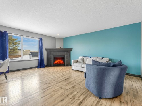 60 Becker Crescent, Fort Saskatchewan, AB - Indoor Photo Showing Living Room With Fireplace