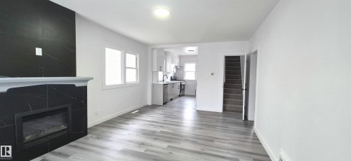 11426 84 Street, Edmonton, AB - Indoor Photo Showing Living Room With Fireplace