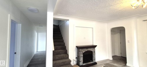 12916 123A Street, Edmonton, AB - Indoor Photo Showing Other Room With Fireplace