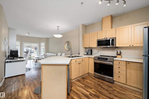 126 4312 139 Avenue, Edmonton, AB - Indoor Photo Showing Kitchen With Stainless Steel Kitchen With Double Sink