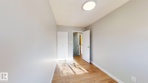 Unfurnished bedroom with light wood-style floors and baseboards - 611 2908 116A Avenue, Edmonton, AB - Indoor Photo Showing Other Room