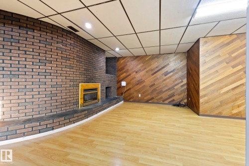 12023 137 Avenue, Edmonton, AB - Indoor Photo Showing Other Room With Fireplace
