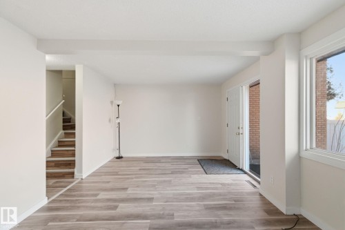 Entrance foyer with stairway and light wood-style flooring - 180 Londonderry Square, Edmonton, AB - Indoor Photo Showing Other Room