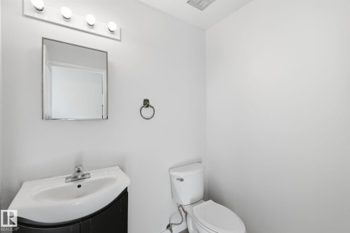 Bathroom featuring vanity and toilet - 180 Londonderry Square, Edmonton, AB - Indoor Photo Showing Bathroom