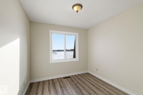 Spare room featuring light wood finished floors and baseboards - 180 Londonderry Square, Edmonton, AB - Indoor Photo Showing Other Room