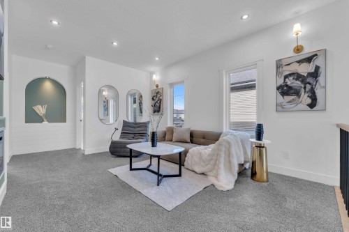 Living area featuring carpet floors and recessed lighting - 228 Linden Loop, Leduc, AB - Indoor Photo Showing Other Room