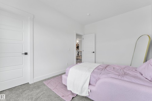 Bedroom with carpet and baseboards - 228 Linden Loop, Leduc, AB - Indoor Photo Showing Bedroom