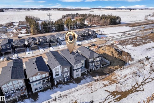 Snowy aerial view featuring a residential view - 228 Linden Loop, Leduc, AB - Outdoor With View