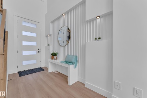 Foyer entrance with light wood finished floors and baseboards - 228 Linden Loop, Leduc, AB - Indoor Photo Showing Other Room