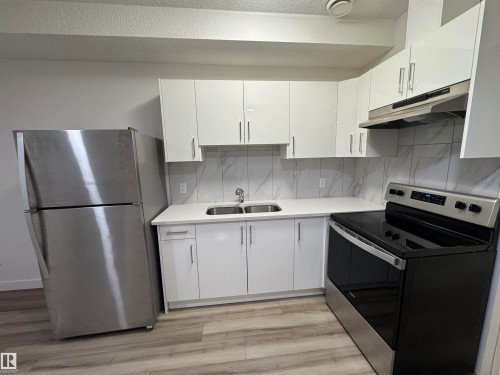 4879 Alwood Point(E), Edmonton, AB - Indoor Photo Showing Kitchen With Double Sink