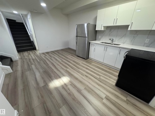 4879 Alwood Point(E), Edmonton, AB - Indoor Photo Showing Kitchen With Double Sink