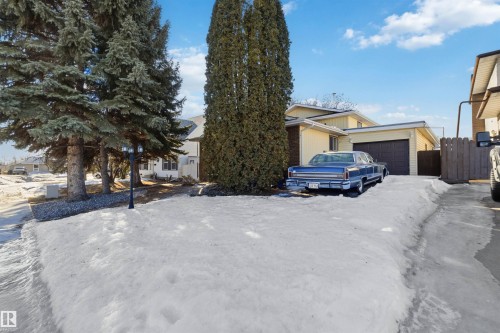 View of front of house with an attached garage - 135 Humberstone Road, Edmonton, AB - Outdoor
