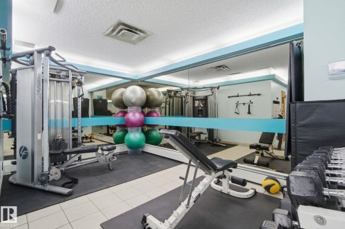 Exercise room with a textured ceiling - 1312 13910 Stony Plain Road, Edmonton, AB - Indoor Photo Showing Gym Room