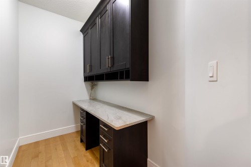 Unfurnished office featuring light wood-type flooring and a textured ceiling - 4811 Woolsey Lane, Edmonton, AB - Indoor Photo Showing Other Room