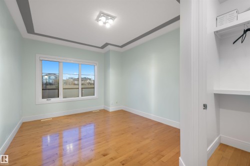 Unfurnished room with light wood-type flooring and baseboards - 4811 Woolsey Lane, Edmonton, AB - Indoor Photo Showing Other Room