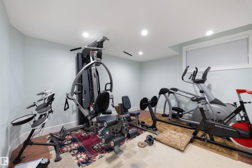 Exercise area with baseboards and recessed lighting - 4811 Woolsey Lane, Edmonton, AB - Indoor Photo Showing Gym Room