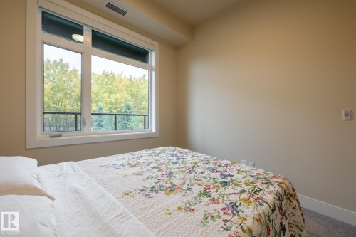 Bedroom featuring carpet floors and baseboards - 7471 May Common, Edmonton, AB - Indoor Photo Showing Bedroom