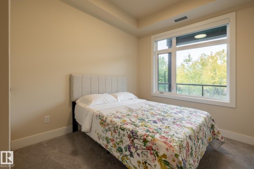 Bedroom with carpet - 7471 May Common, Edmonton, AB - Indoor Photo Showing Bedroom