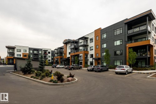 View of property with uncovered parking - 7471 May Common, Edmonton, AB - Outdoor With Facade