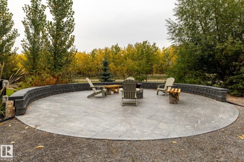 View of patio with an outdoor fire pit - 7471 May Common, Edmonton, AB - Outdoor With Backyard