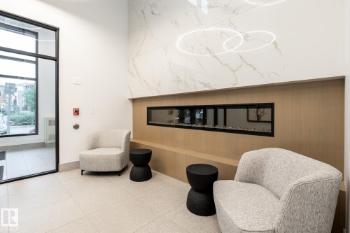 View of common area - 7471 May Common, Edmonton, AB - Indoor With Fireplace