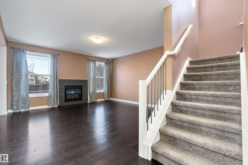 103 Rosemount Bay, Beaumont, AB - Indoor Photo Showing Other Room With Fireplace